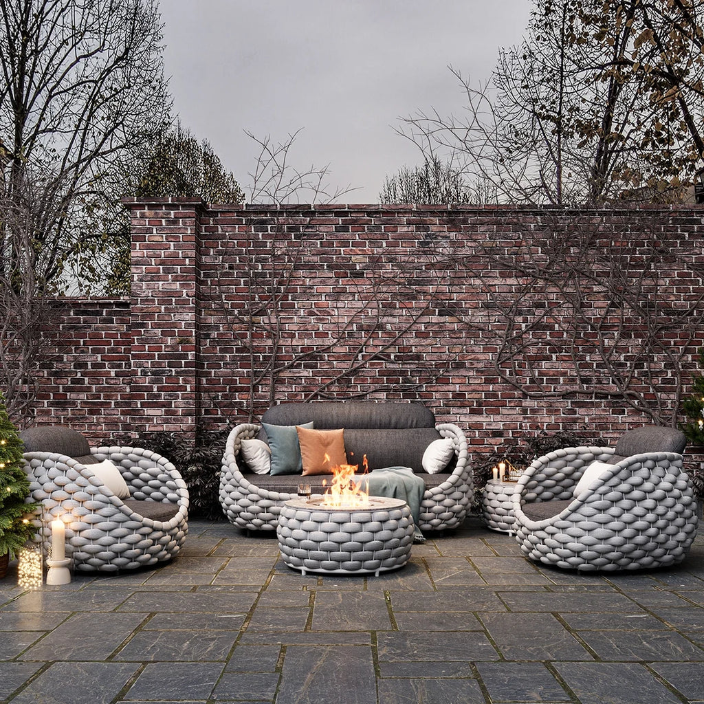 Outdoor scene with Cornwall rope furniture near brick wall
