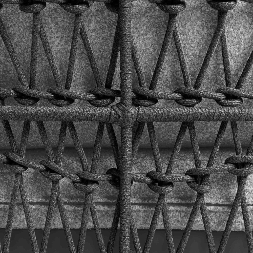 Close-up of handwoven rope detailing and grey seat cushions in Florence outdoor chair
