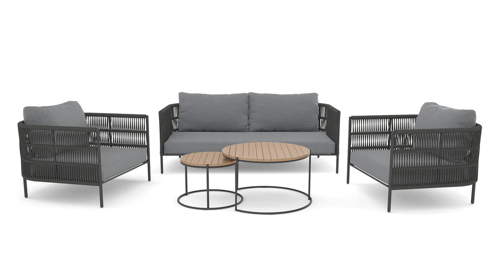Zenith outdoor patio sofa set in a scenic outdoor garden setting with handwoven rope and glass top table